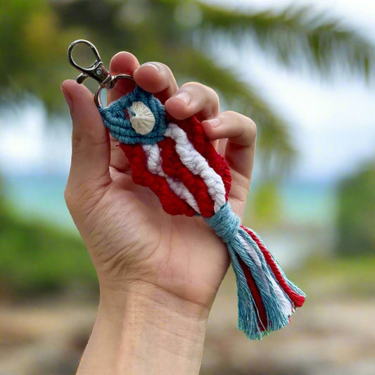 Hand holding Puerto Rico flag macrame keychain